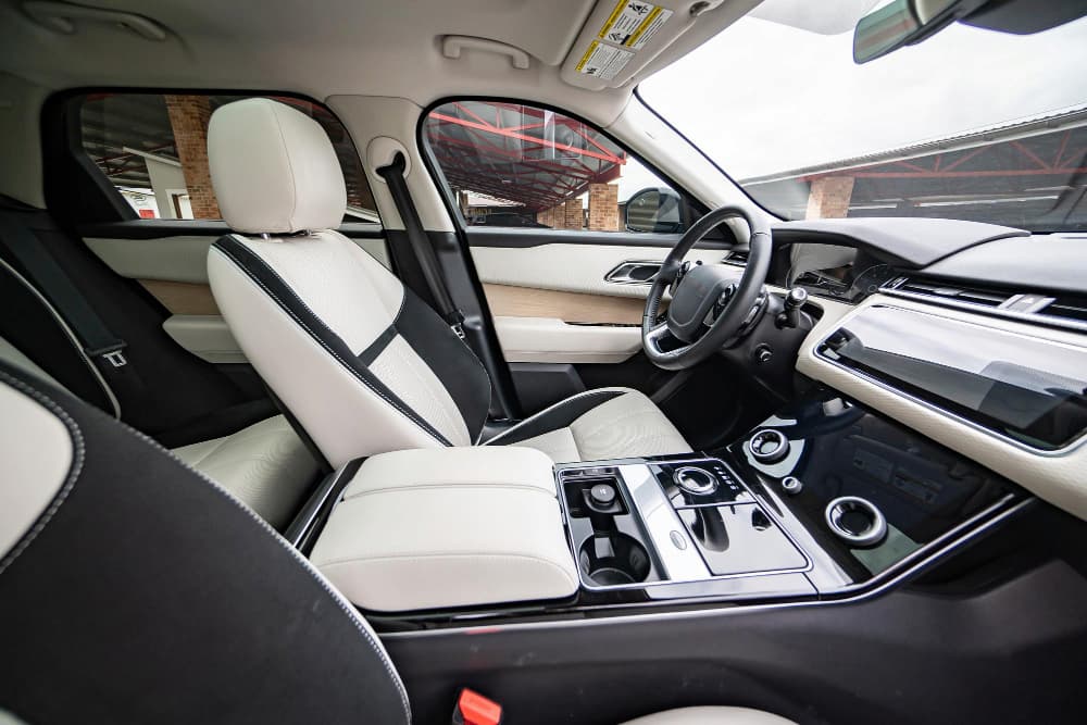modern-luxury-prestige-car-interior-dashboard-steering-wheel-orange-red-perforated-leather-interior